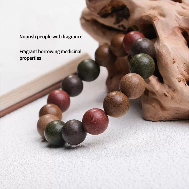 A Chinese Five - Elements Herbal Incense Bead Bracelet resting on a piece of wood, with text highlighting its function of nourishing people with fragrance and borrowing medicinal properties.